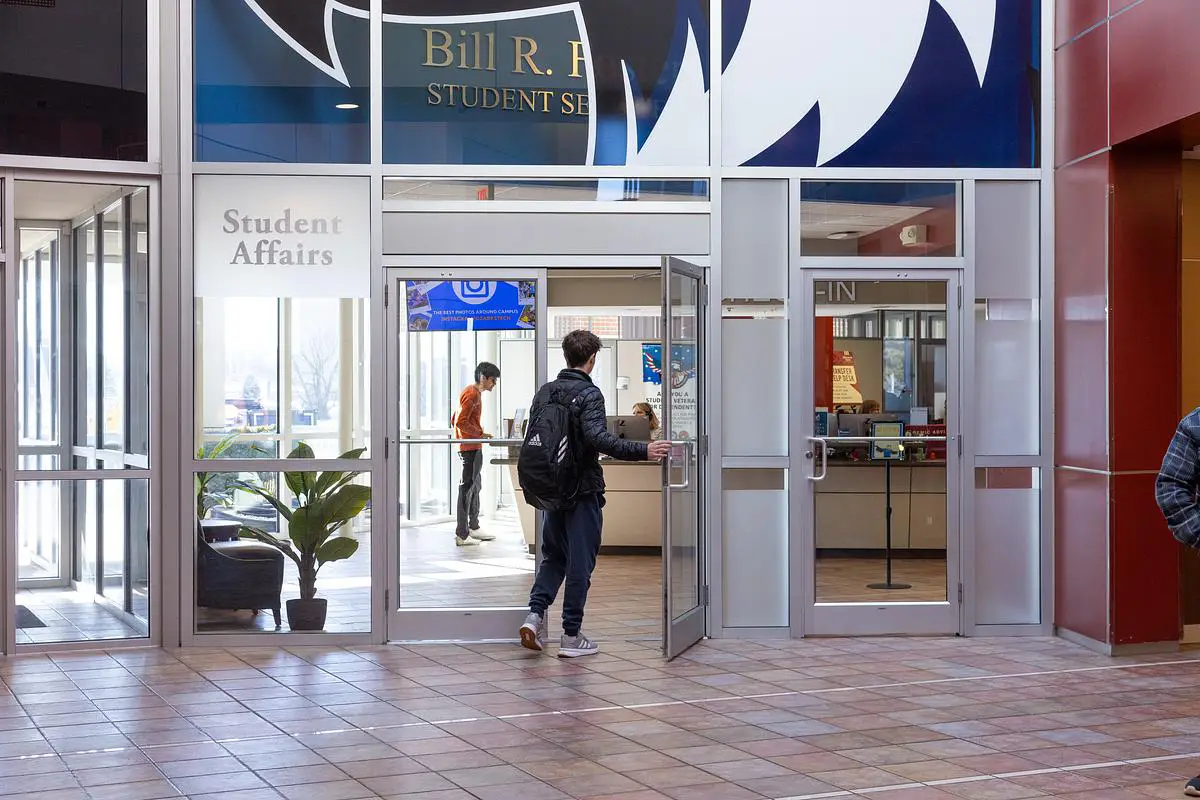 A student walks into the Student Affairs office inside the Bill R. Foster Student Services building at Ozarks Technical Community College.