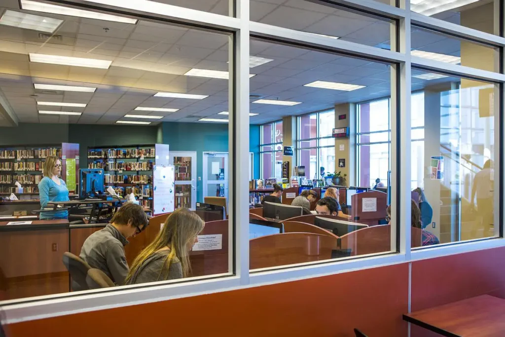 Students study on computers inside the Richwood Valley Campus library at Ozarks Technical Community College.