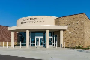 Exterior entrance of Ozarks Tech’s Republic Education Center under a clear blue sky.
