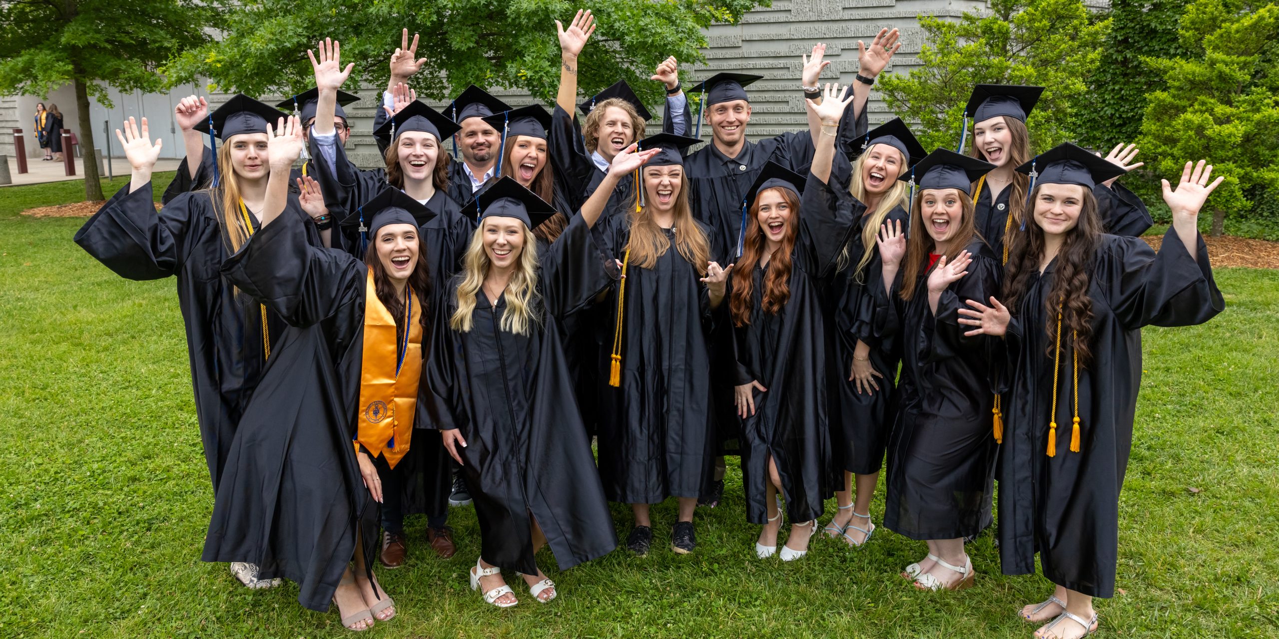 Ozarks Tech students are depicted wearing graduation regalia