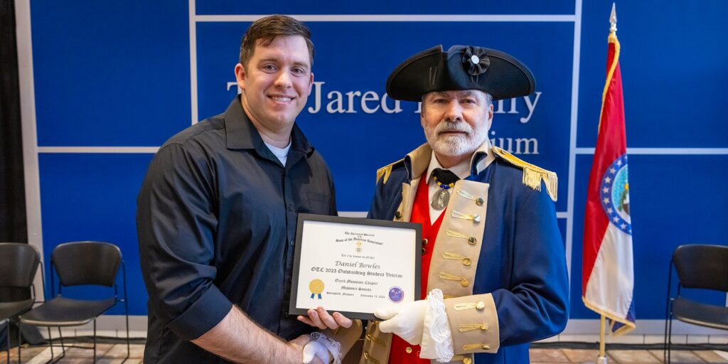 Respiratory Therapy student Daniel Bowles is depicted receiving an Outstanding Veteran Student award 