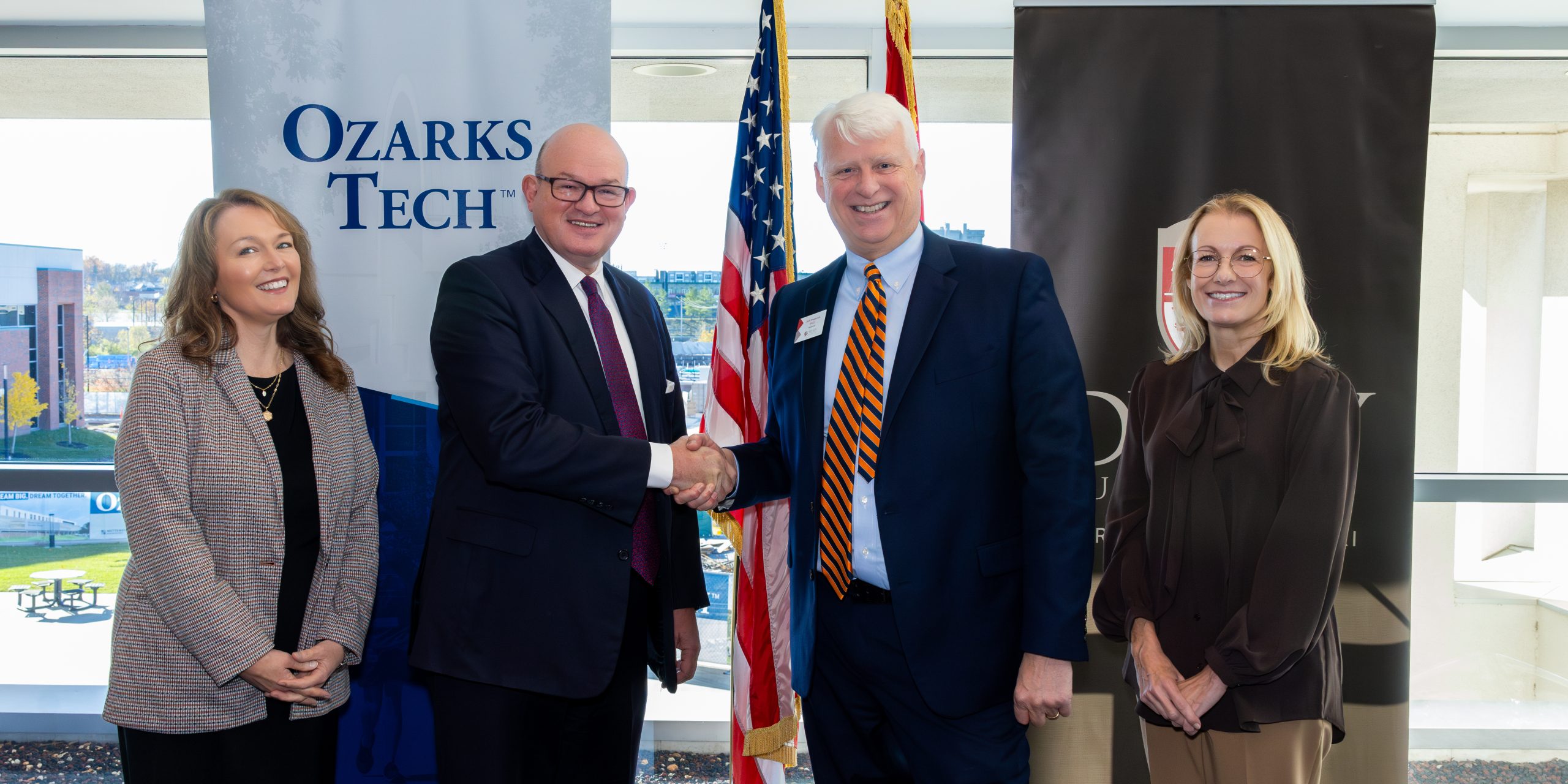 The deans of Ozarks Tech and Drury University are depicted shaking hands