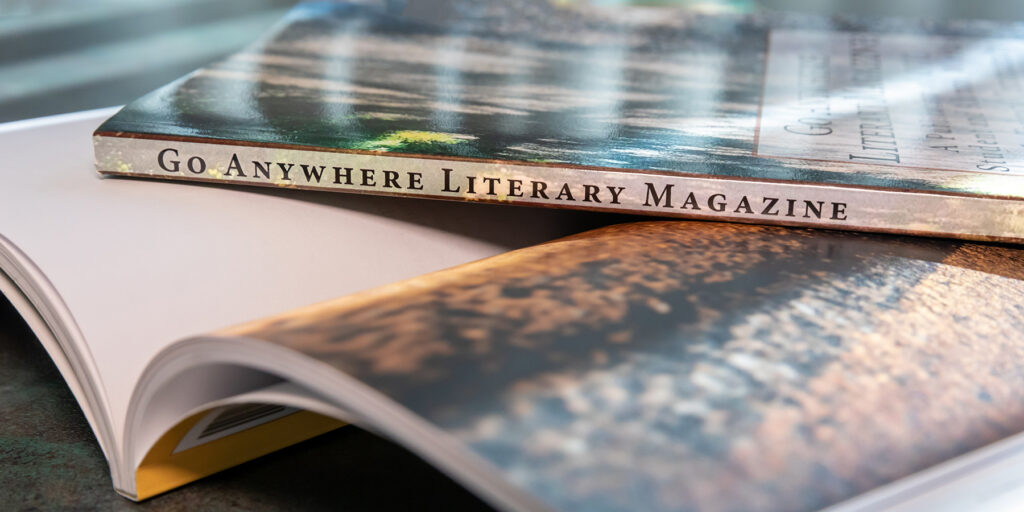 A copy of the Go Anywhere Literary Magazine is depicted