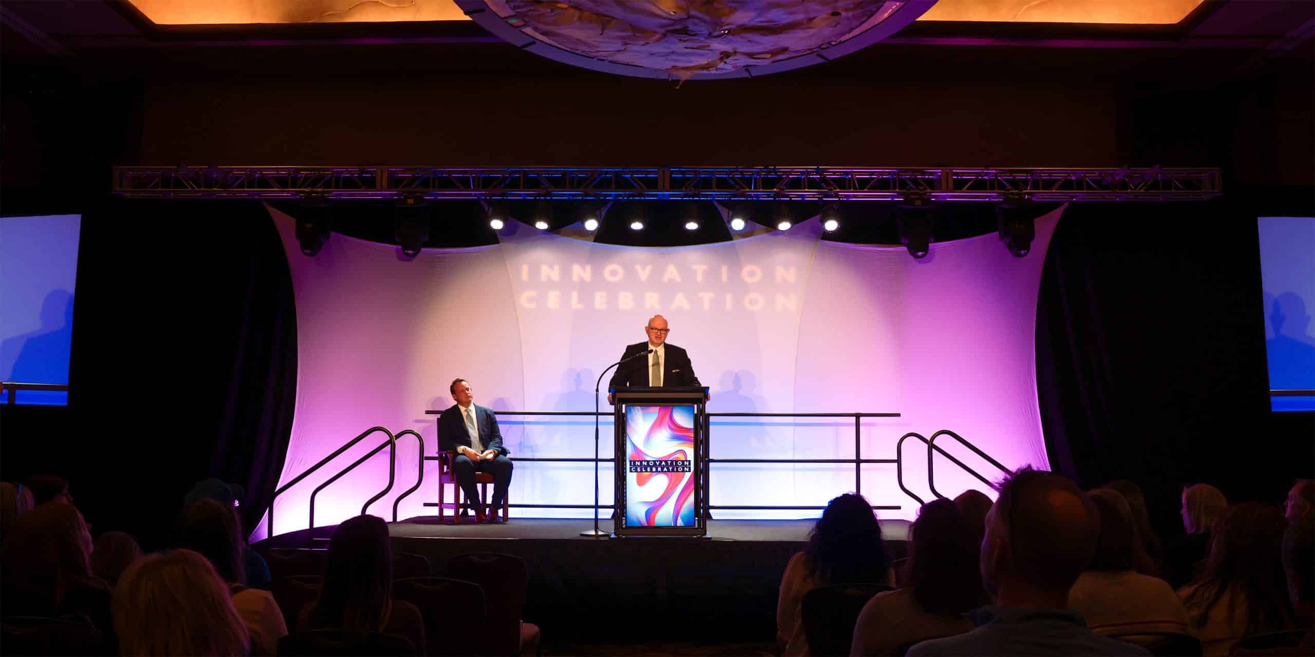 Hal Higdon is depicted speaking at Ozarks Tech's annual Innovation Celebration