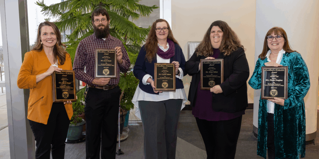 Ozarks Tech Excellence in Education award recipients are depicted holding their plaques