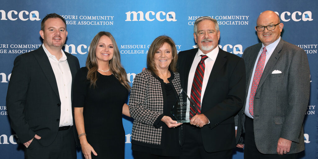 Representatives of Rick’s Automotive are depicted holding a Missouri Community College Association Distinguished Business & Industry Award 