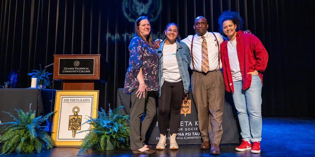 Two generations of the Thomas family are depicted at a Phi Theta Kappa Honor Society induction ceremony
