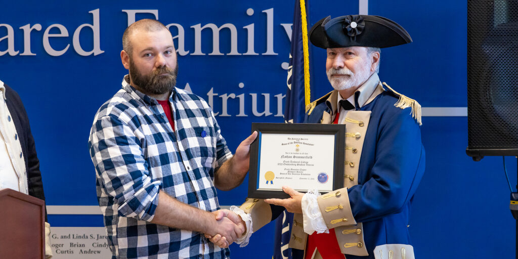 Ozarks Tech student Nathan Summerfield is depicted receiving the Outstanding Student Veteran Award