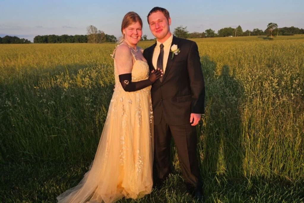 William and Landrey Black are depicted standing together in a field