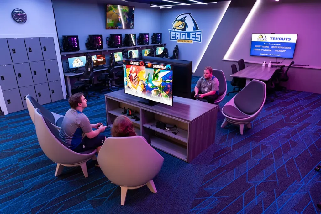 Students gather around TV to play games at ESports lounge