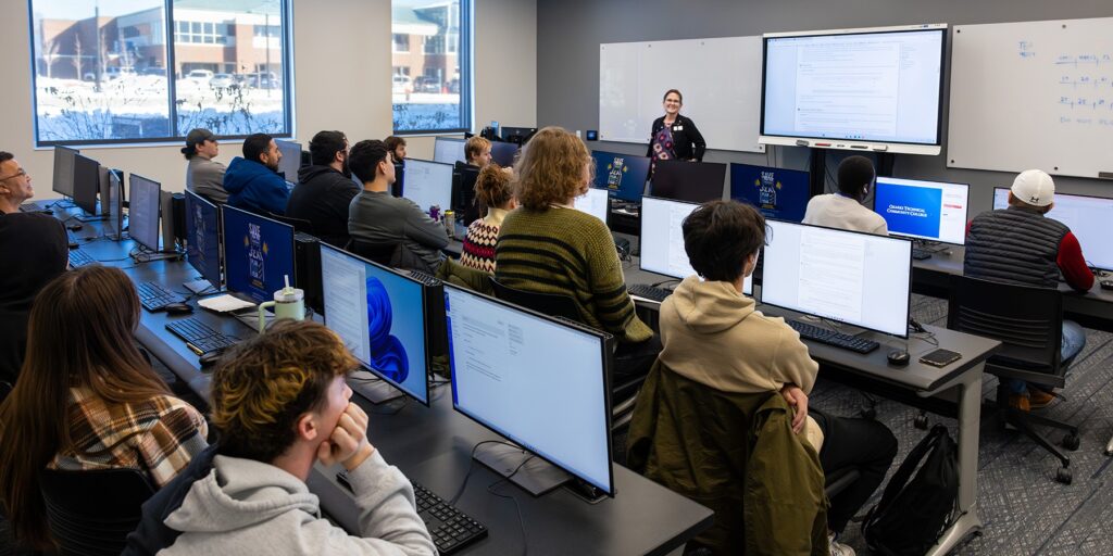 Ozarks Tech students are depicted taking a class in a computer lab