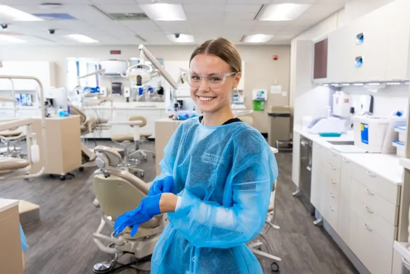 Dental student stands in clinic