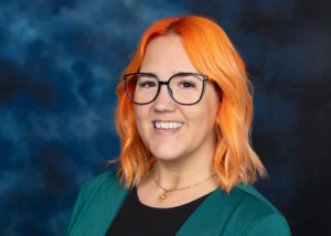 Portrait of woman wearing glasses smiling at the camera
