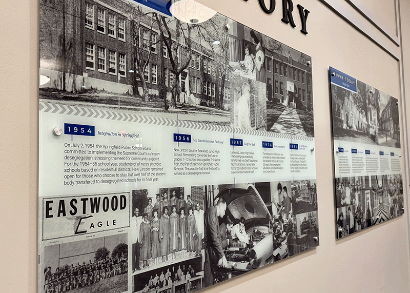 Two wall panels with text and images that tell the history of historic Lincoln Hall at Ozarks Tech 