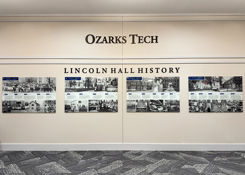 Four wall panel displays with text and photos tell the chronological story of historic Lincoln Hall at Ozarks Tech